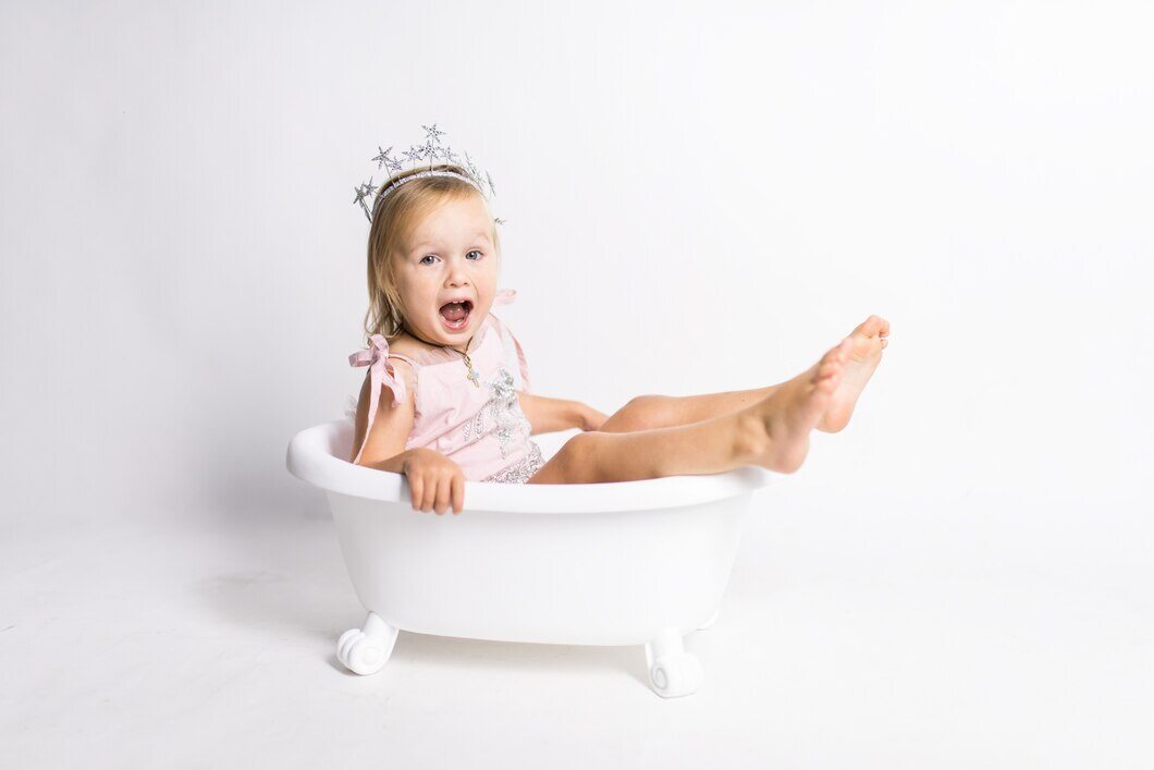 funny-little-blonde-girl-sits-bath-studio_8353-7272